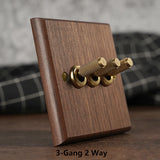 RetroLux Zwart Walnoot 1–4 Gang Wandschakelaar met Messing Toggle