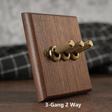 RetroLux Zwart Walnoot 1–4 Gang Wandschakelaar met Messing Toggle