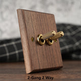RetroLux Zwart Walnoot 1–4 Gang Wandschakelaar met Messing Toggle