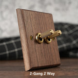 RetroLux Zwart Walnoot 1–4 Gang Wandschakelaar met Messing Toggle