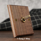 RetroLux Zwart Walnoot 1–4 Gang Wandschakelaar met Messing Toggle